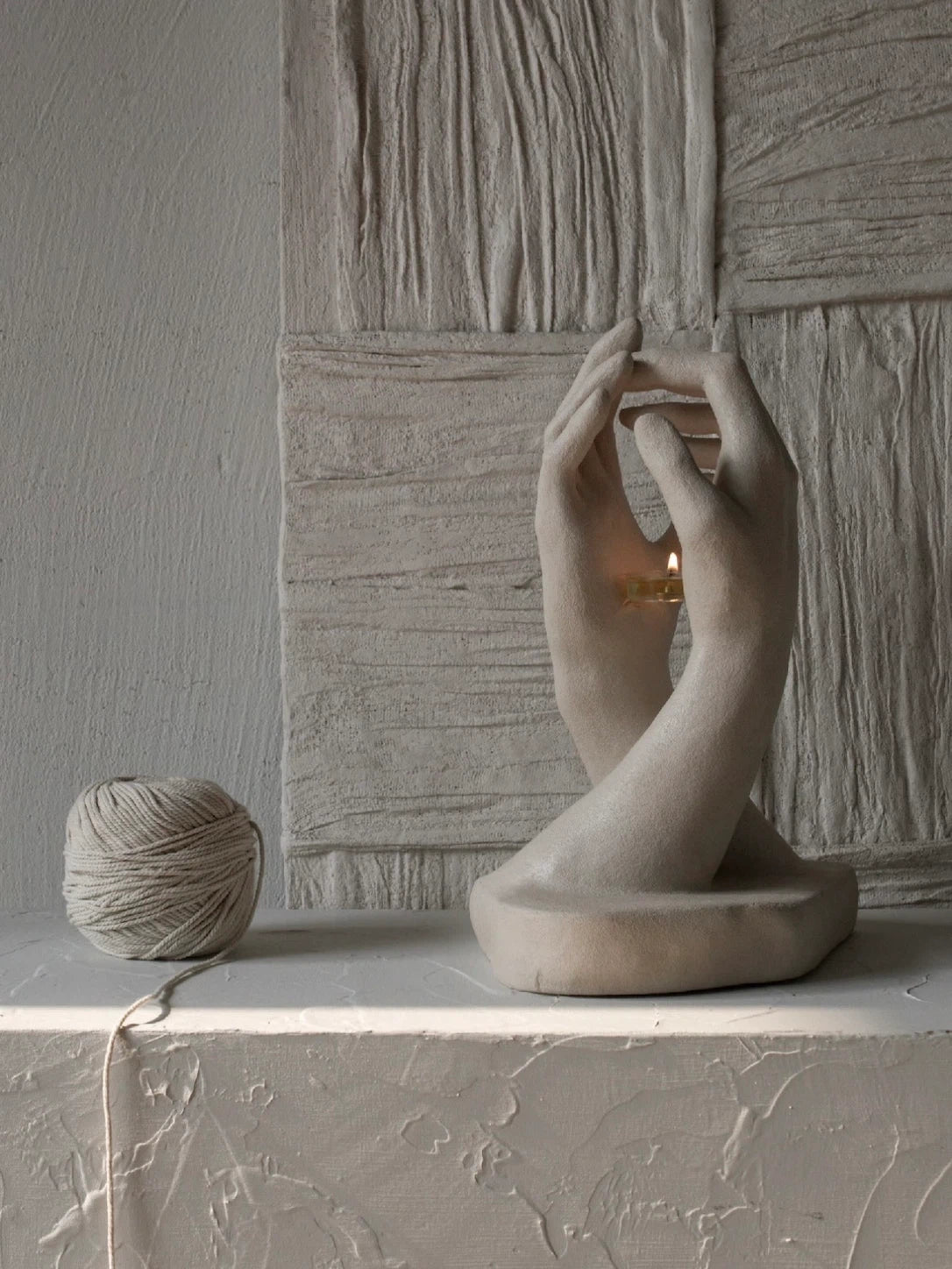 INTERLACED HANDS CANDLE HOLDER