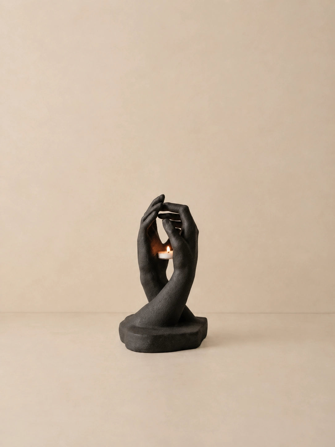 INTERLACED HANDS CANDLE HOLDER