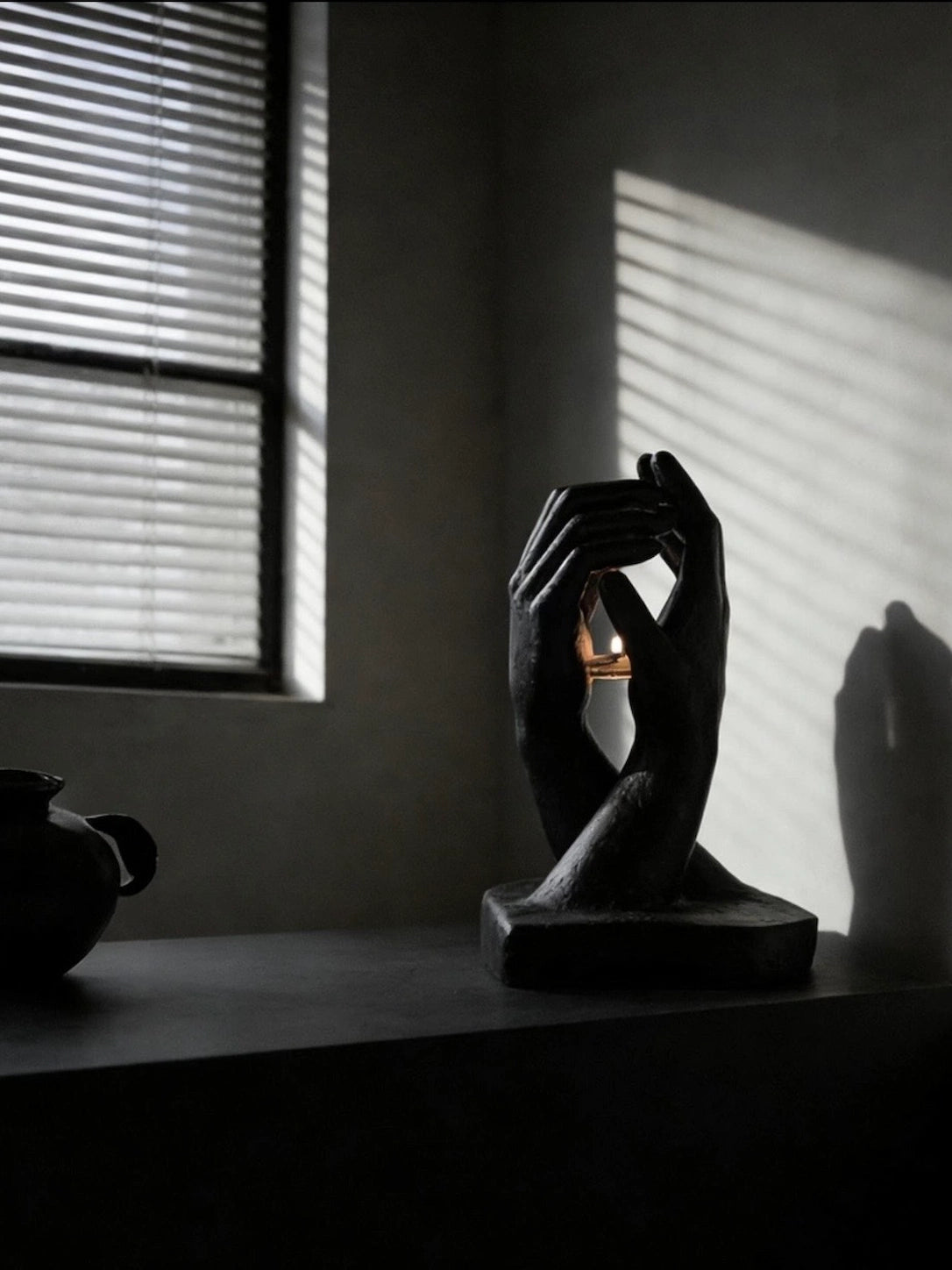 INTERLACED HANDS CANDLE HOLDER